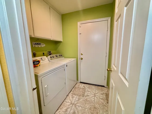 a bedroom with a bed and a dresser in it