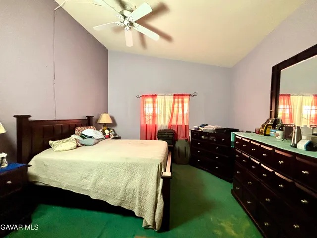 a bed room with a bed and a window