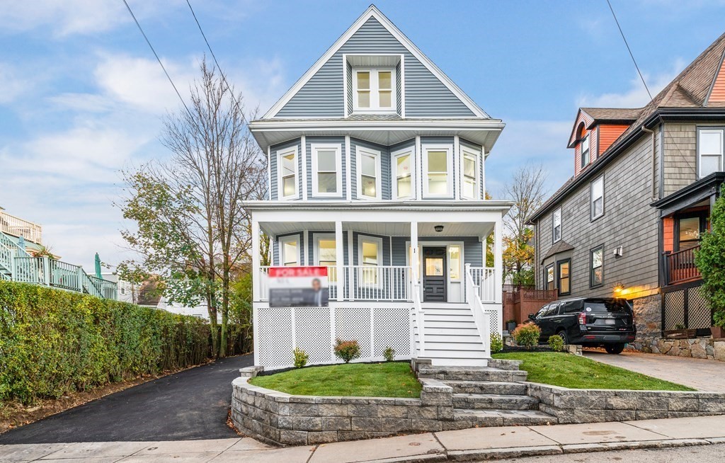 1 Claymont Terrace Boston, MA 02122 - Photo 1 of 42 a front view of a house with a yard