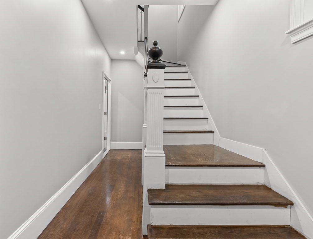 1 Claymont Terrace Boston, MA 02122 - Photo 11 of 42 a view of entryway and hall with wooden floor
