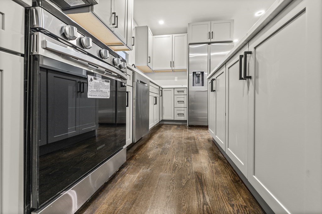 1 Claymont Terrace Boston, MA 02122 - Photo 13 of 42 a view of entryway and hall with wooden floor