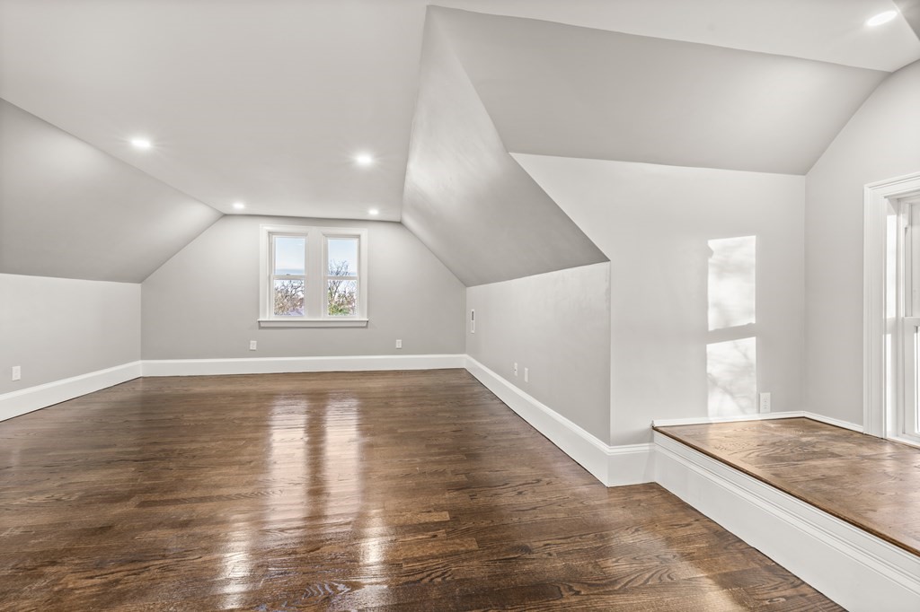 1 Claymont Terrace Boston, MA 02122 - Photo 31 of 42 an empty room with wooden floor and windows