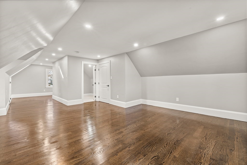 1 Claymont Terrace Boston, MA 02122 - Photo 34 of 42 an empty room with wooden floor and windows