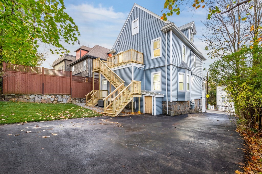 1 Claymont Terrace Boston, MA 02122 - Photo 7 of 42 a view of a house with a yard and potted plants