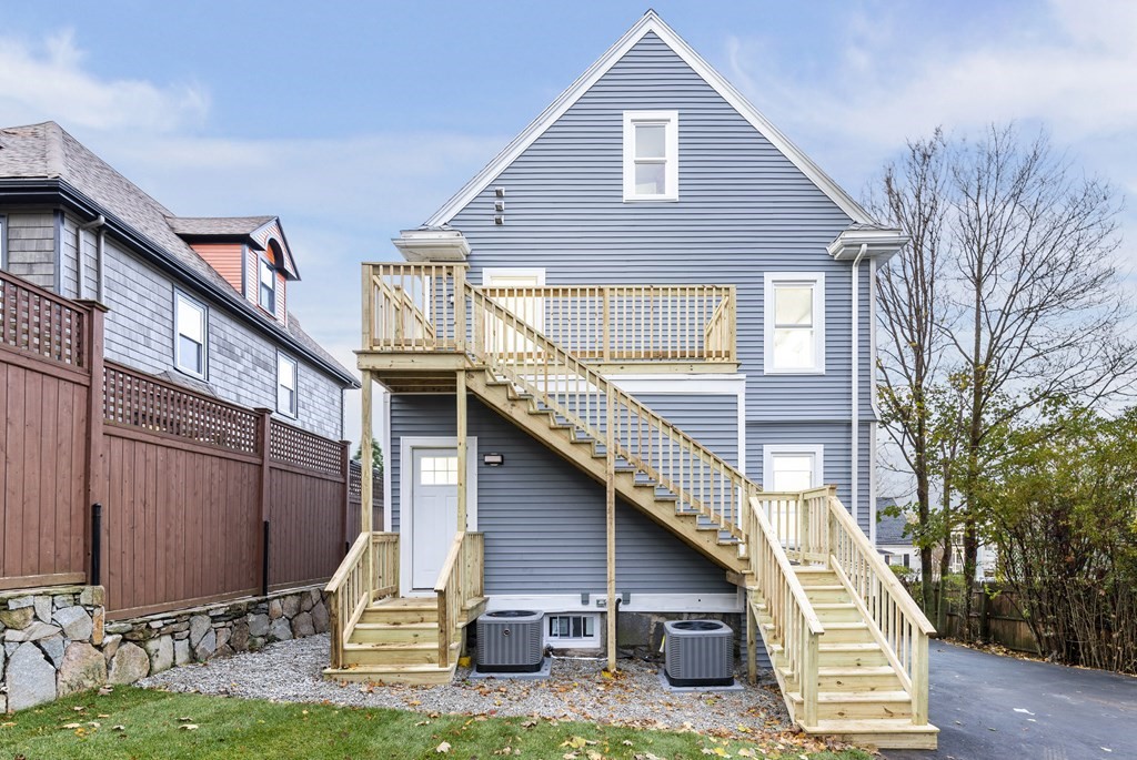 1 Claymont Terrace Boston, MA 02122 - Photo 8 of 42 a view of a house with a yard