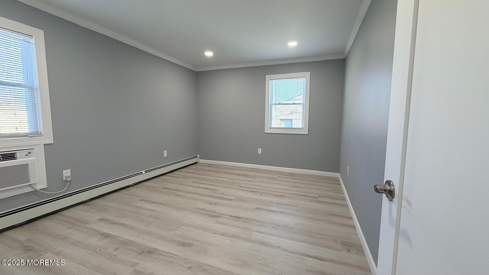 420 Cross Road, Unit B16 Matawan, NJ 07747 - Photo 12 of 29 an empty room with windows