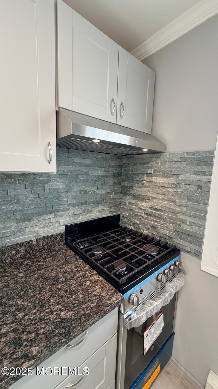 420 Cross Road, Unit B16 Matawan, NJ 07747 - Photo 23 of 36 a stove top oven sitting inside of a kitchen