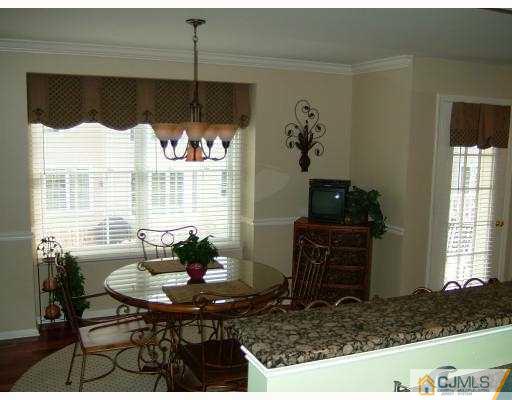 49 Raritan Reach Road South Amboy, NJ 08879 - Photo 4 of 10 a living room with furniture and a window