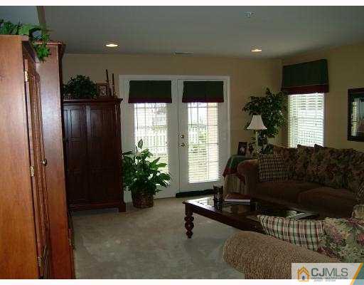 49 Raritan Reach Road South Amboy, NJ 08879 - Photo 7 of 10 a living room with furniture potted plant and a window