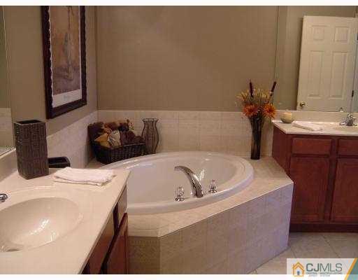 49 Raritan Reach Road South Amboy, NJ 08879 - Photo 9 of 10 a bathroom with a bathtub and sink