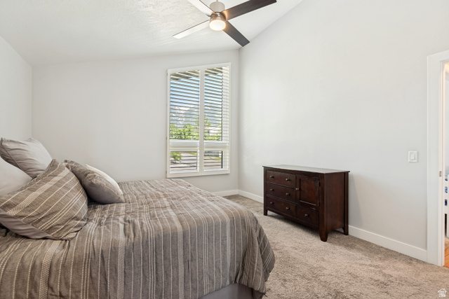 9832 Falconhurst Drive Sandy, UT 84092 - Photo 11 of 29 Vaulted ceiling featuring a ceiling fan with light fixture