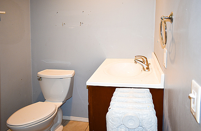 114 East Cleveland Street Spring Valley, IL 61362 - Photo 14 of 21 a bathroom with a toilet and a sink