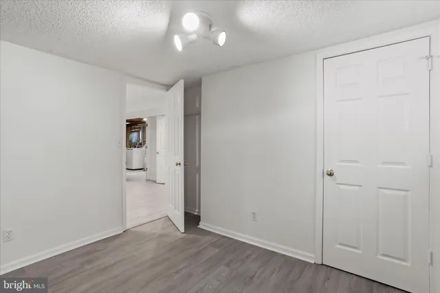 an empty room with wooden floor