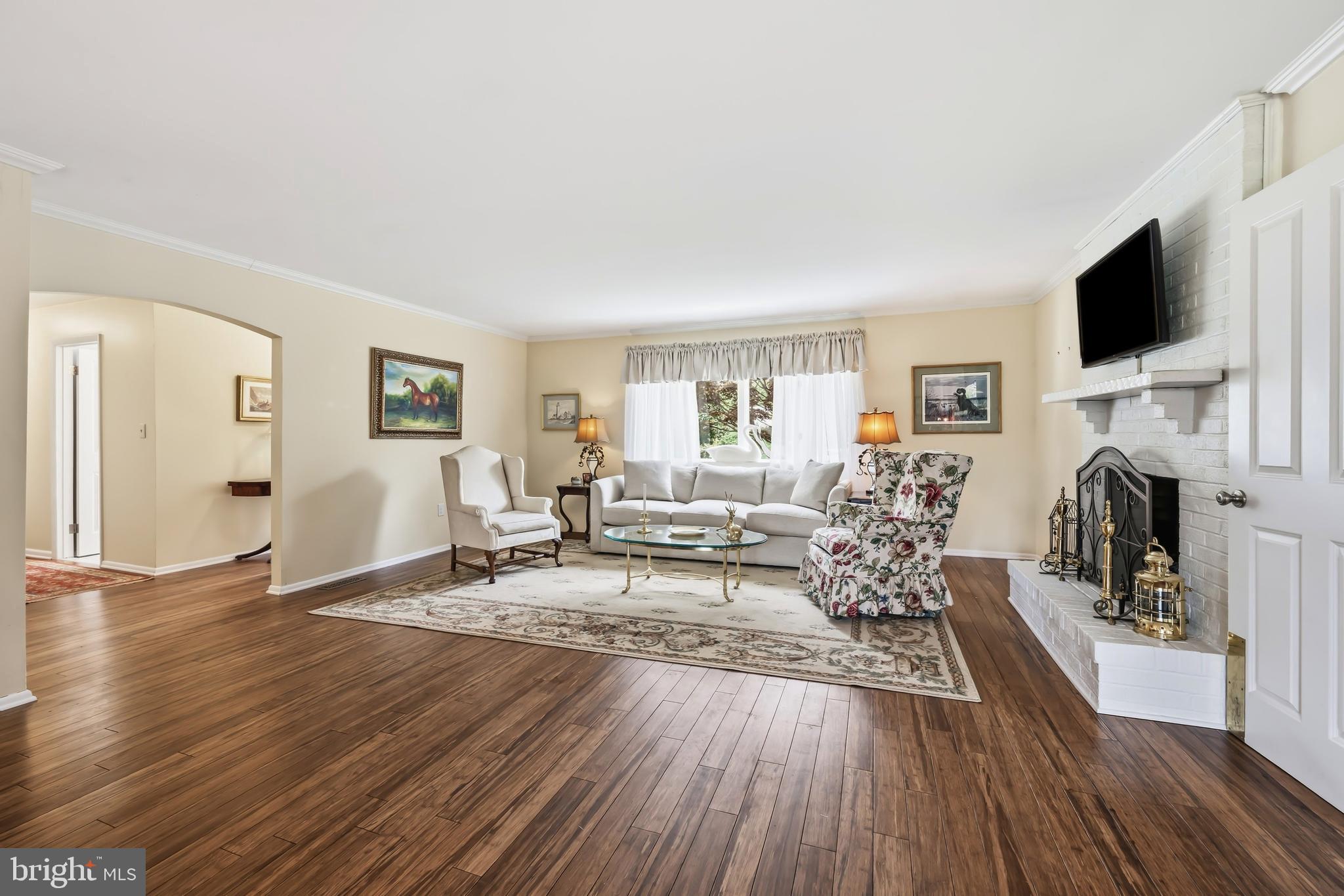 24561 Deepwater Point Drive St. Michaels, MD 21663 - Photo 12 of 50 a living room with furniture fireplace and flat screen tv