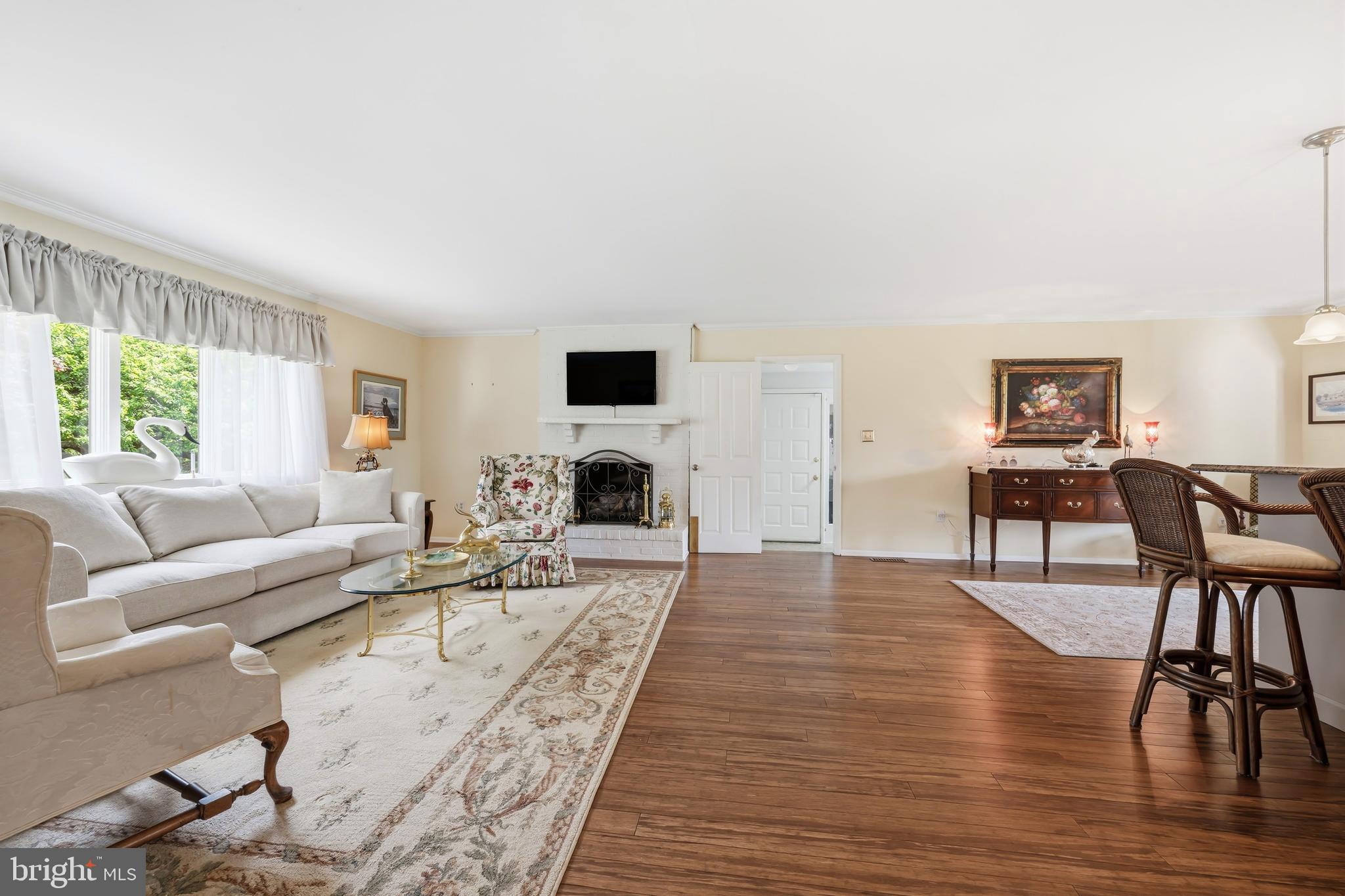 24561 Deepwater Point Drive St. Michaels, MD 21663 - Photo 15 of 50 a living room with furniture and a fireplace