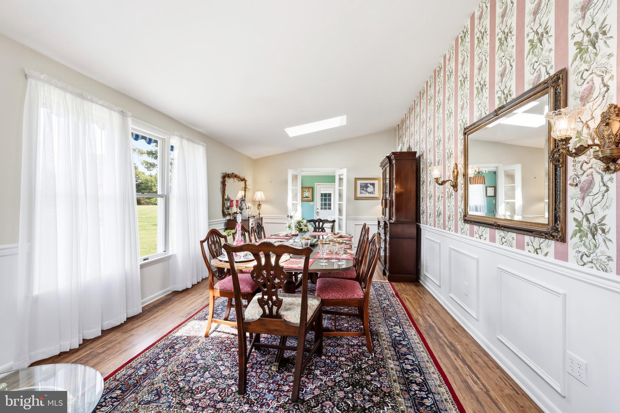 24561 Deepwater Point Drive St. Michaels, MD 21663 - Photo 24 of 50 a view of a dining room with furniture window and wooden floor