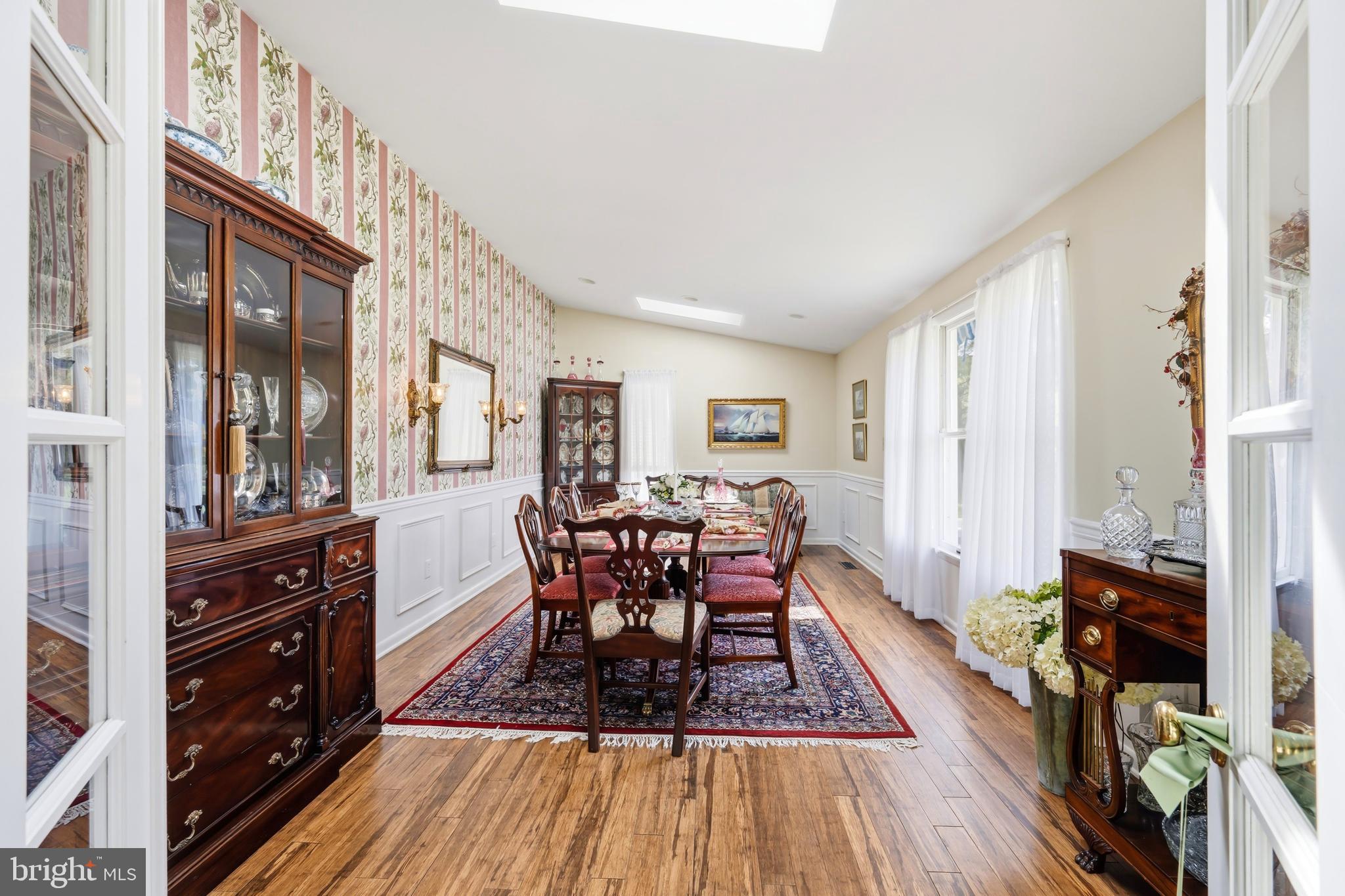 24561 Deepwater Point Drive St. Michaels, MD 21663 - Photo 25 of 50 a view of a dining room with furniture window and wooden floor