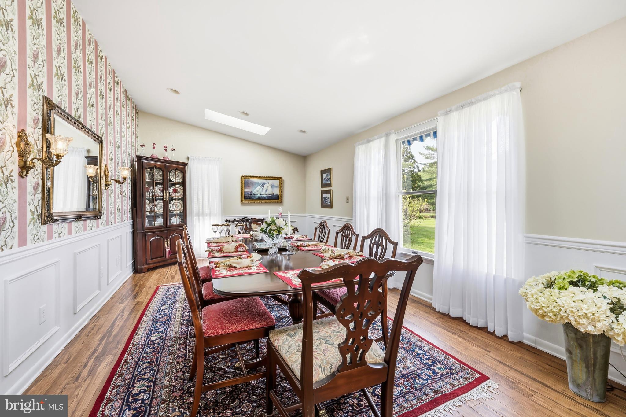 24561 Deepwater Point Drive St. Michaels, MD 21663 - Photo 26 of 50 a dining room with furniture and wooden floor