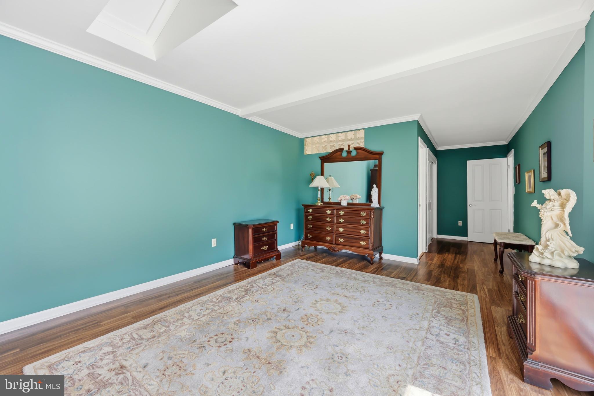 24561 Deepwater Point Drive St. Michaels, MD 21663 - Photo 28 of 50 a bedroom with a bed and a dresser in it