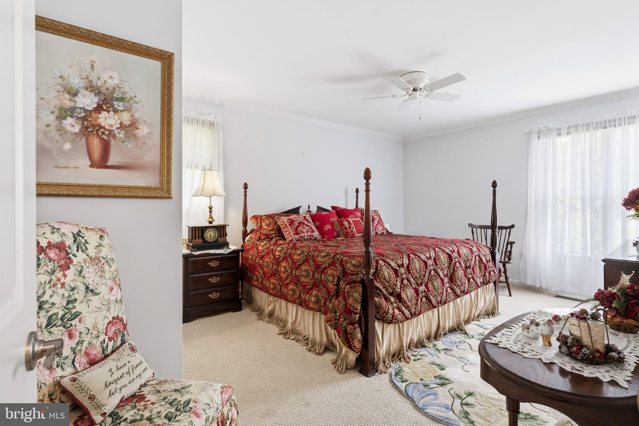 24561 Deepwater Point Drive St. Michaels, MD 21663 - Photo 30 of 50 a bedroom with a bed and a painting on the wall