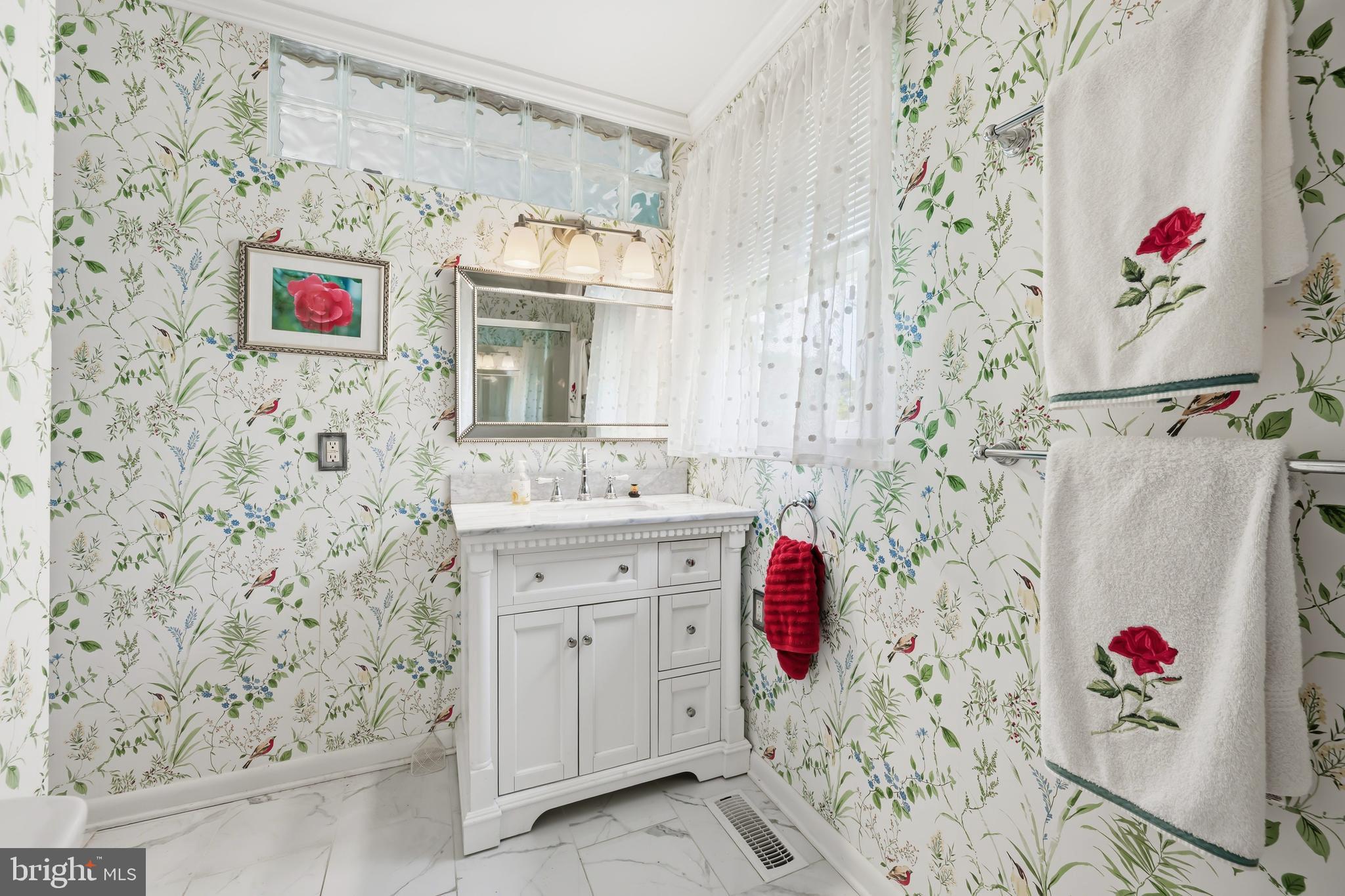 24561 Deepwater Point Drive St. Michaels, MD 21663 - Photo 33 of 50 a bathroom with a sink and a shower curtain