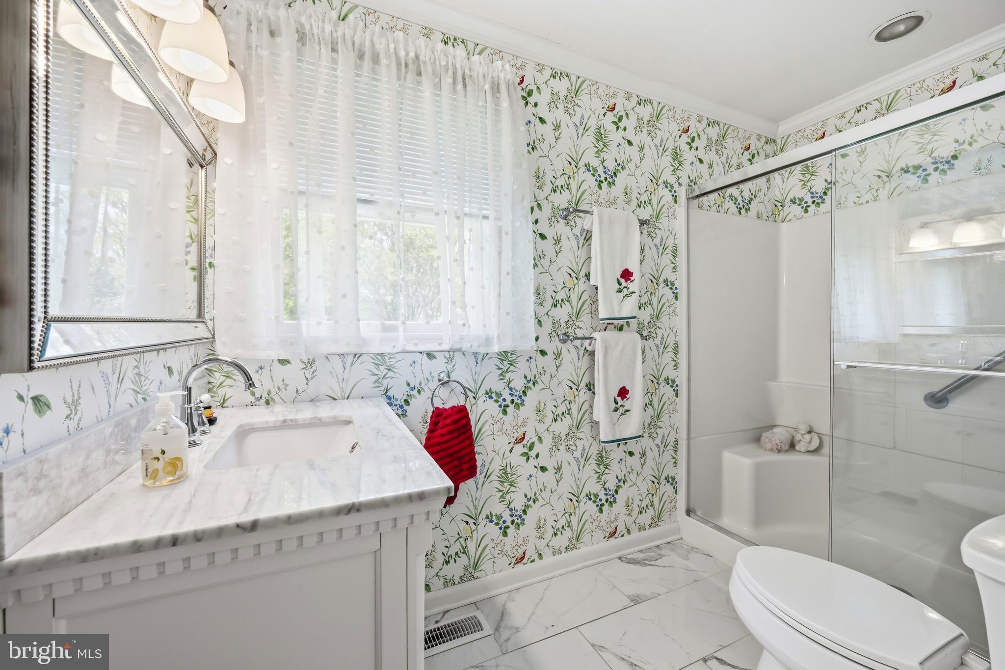 24561 Deepwater Point Drive St. Michaels, MD 21663 - Photo 34 of 50 a bathroom with a sink toilet and shower