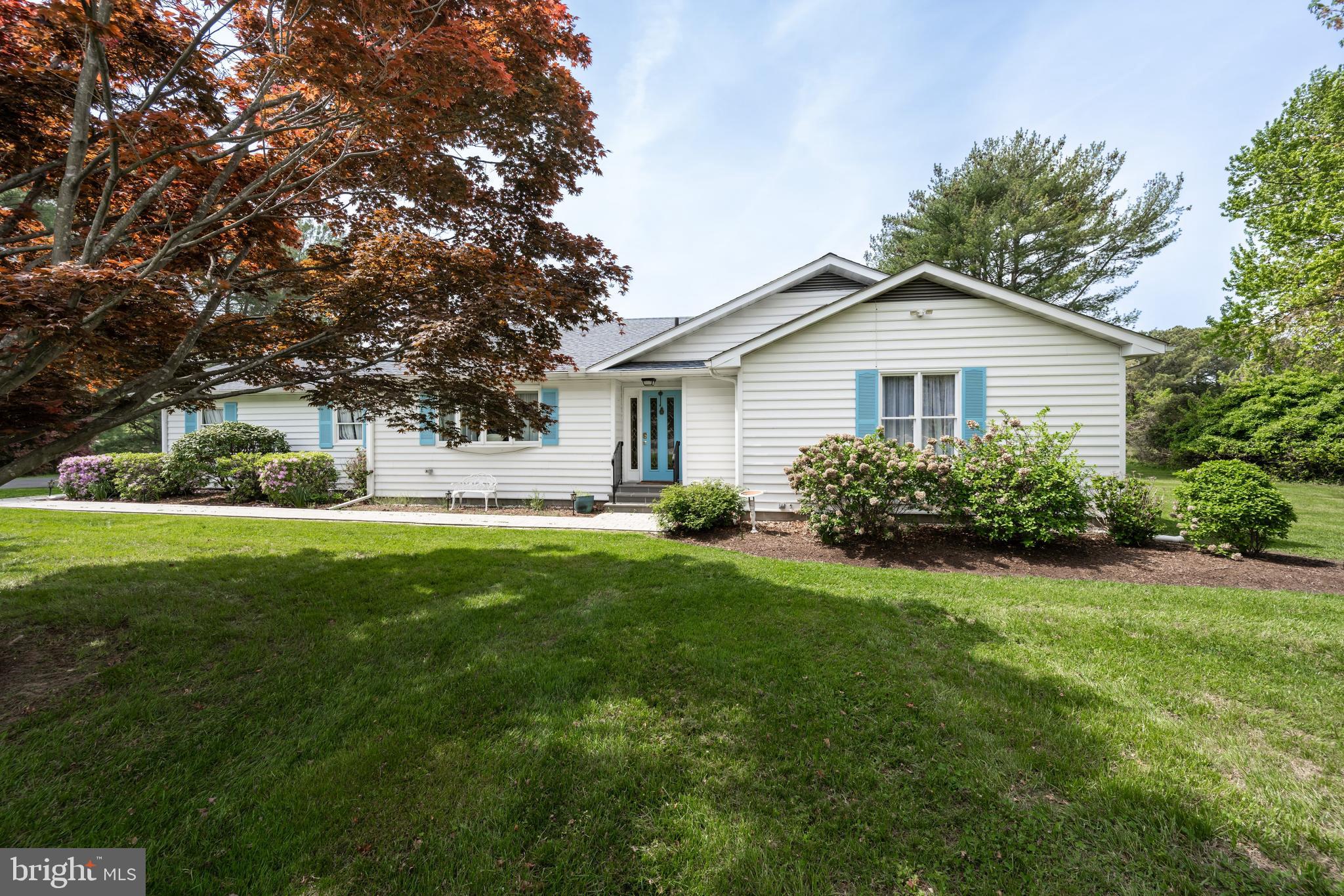 24561 Deepwater Point Drive St. Michaels, MD 21663 - Photo 4 of 50 a view of a house with yard and garden