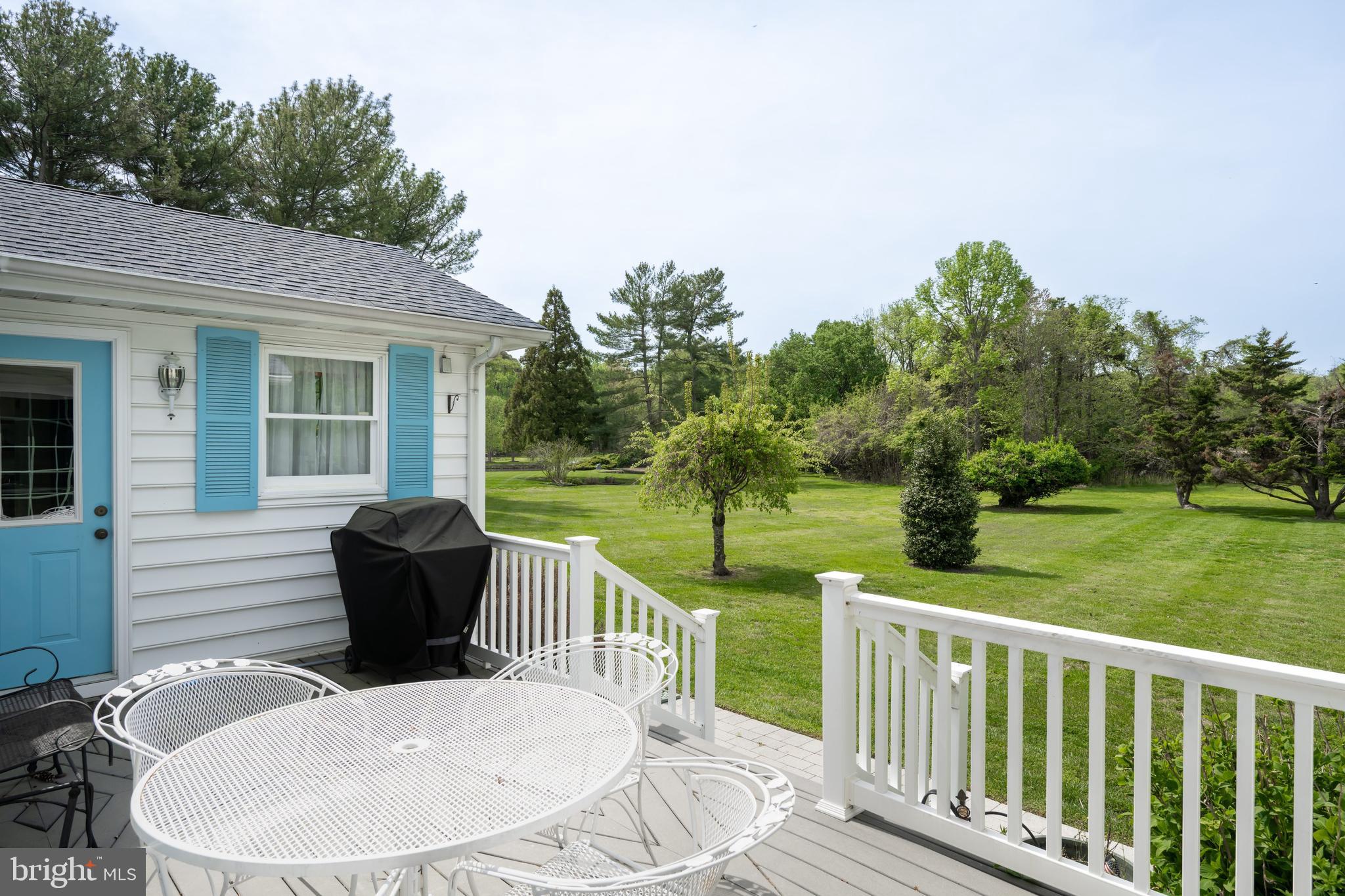 24561 Deepwater Point Drive St. Michaels, MD 21663 - Photo 7 of 50 a view of a deck with furniture