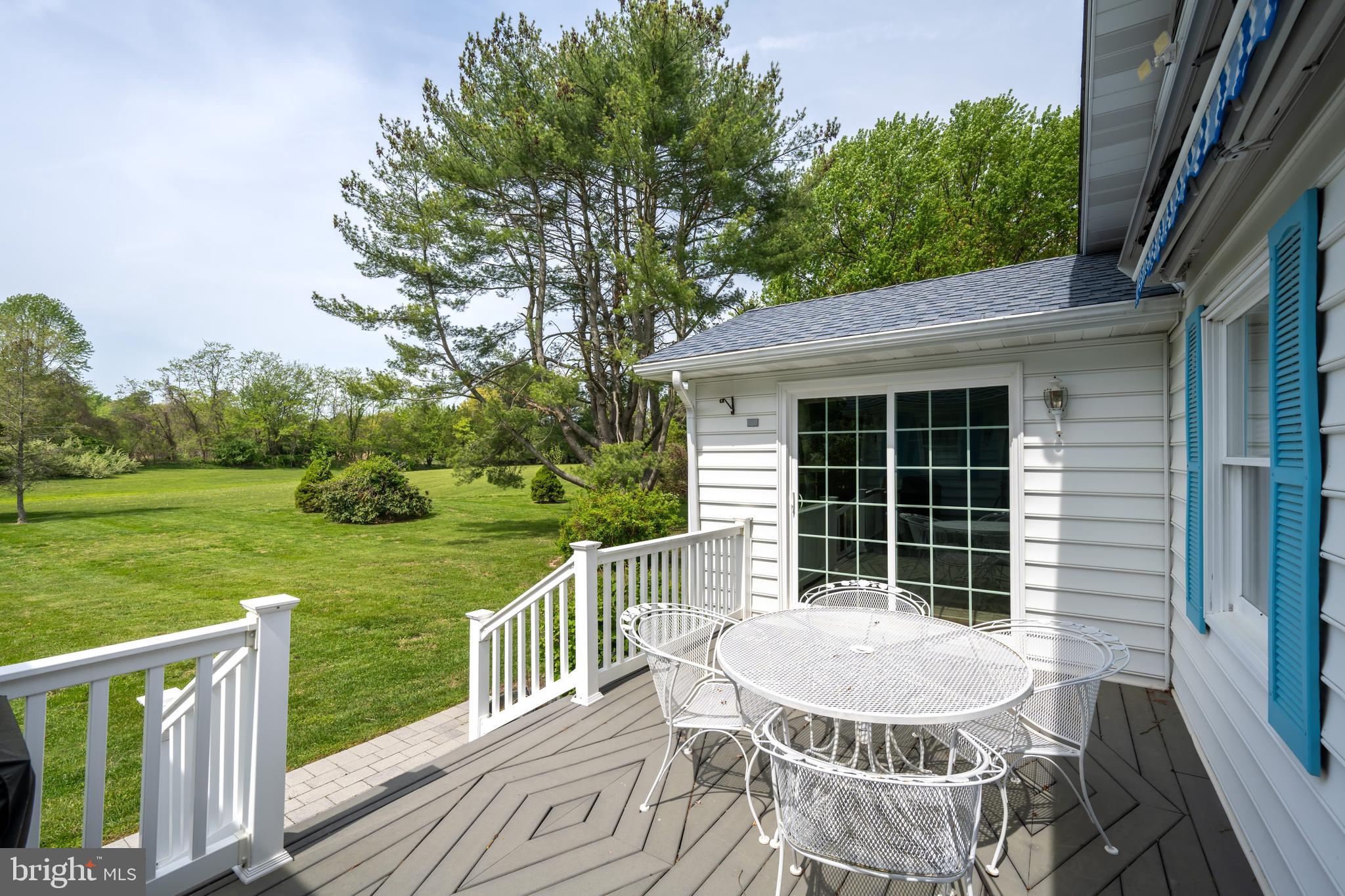 24561 Deepwater Point Drive St. Michaels, MD 21663 - Photo 8 of 50 a view of a chair and table in the deck