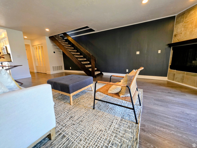 5265 South Rome Beauty Park Murray, UT 84123 - Photo 15 of 35 Living area with recessed lighting, wood finished floors, and wood walls