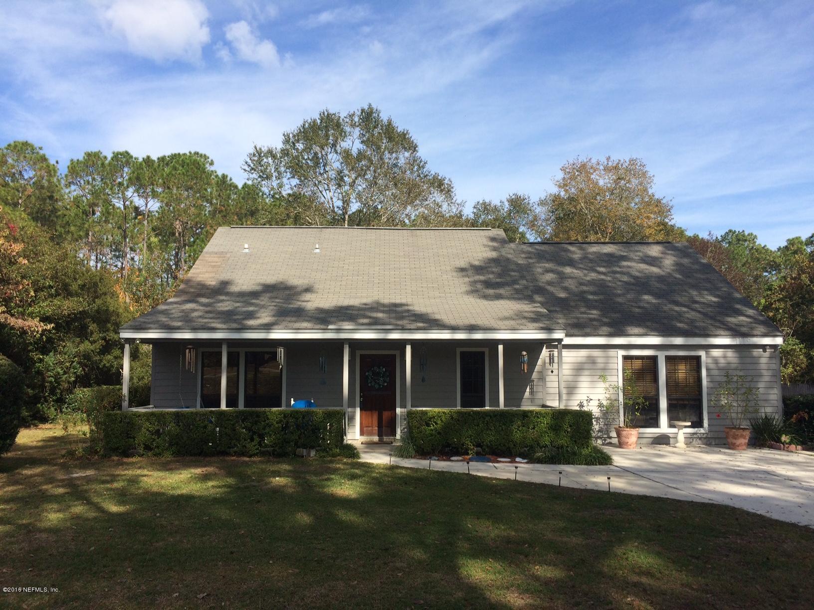 1112 Cactus Cut Road Middleburg, FL 32068 - Photo 1 of 48 a front view of house with yard and green space