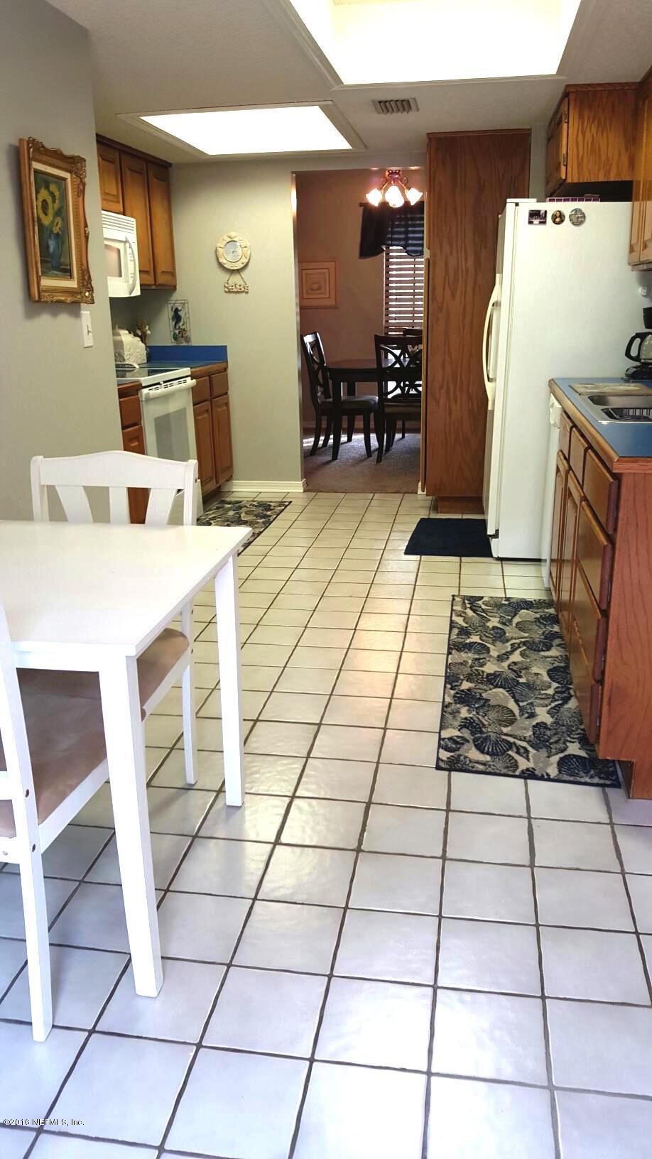 1112 Cactus Cut Road Middleburg, FL 32068 - Photo 14 of 48 a kitchen with granite countertop a stove a sink and a refrigerator