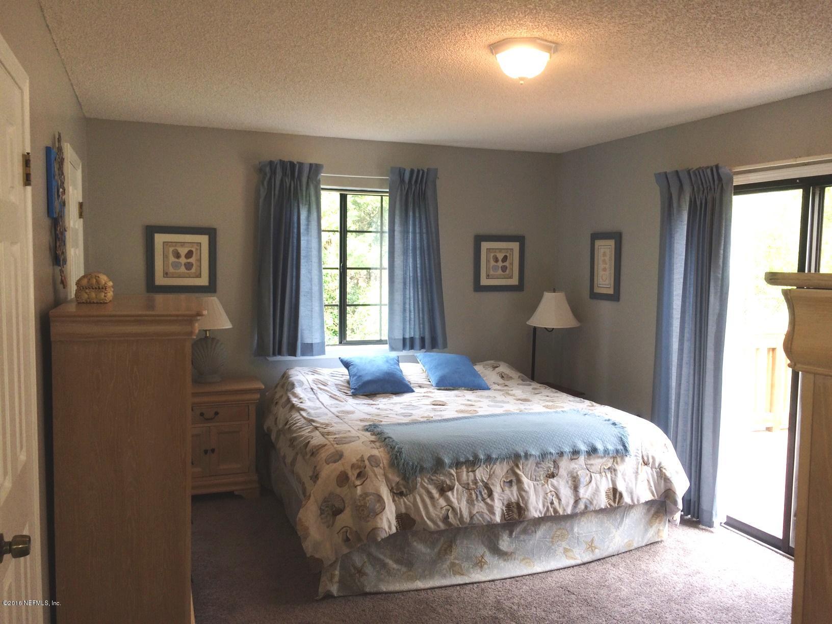 1112 Cactus Cut Road Middleburg, FL 32068 - Photo 16 of 48 a bedroom with a bed and window