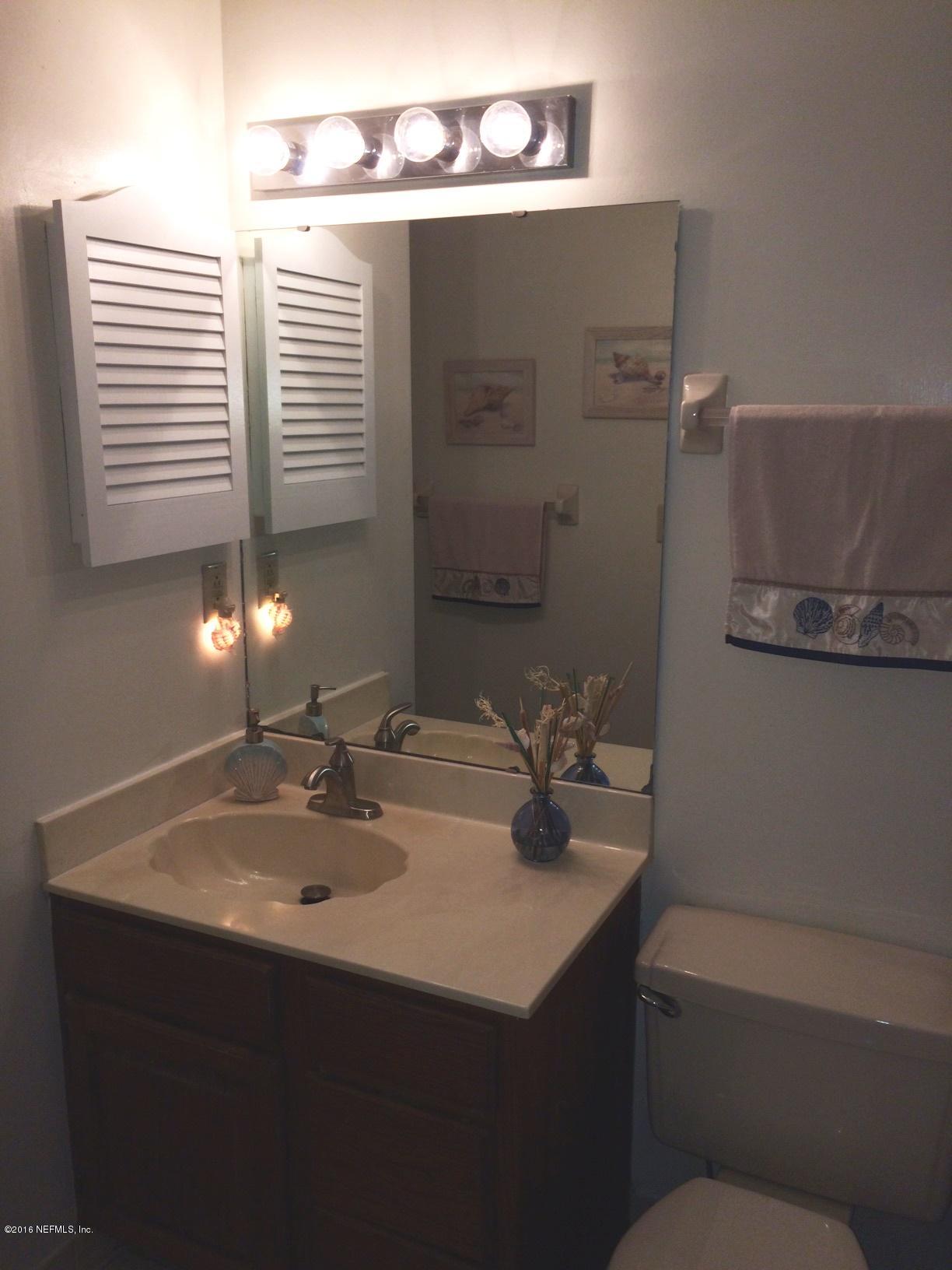 1112 Cactus Cut Road Middleburg, FL 32068 - Photo 18 of 48 a bathroom with a sink toilet and window