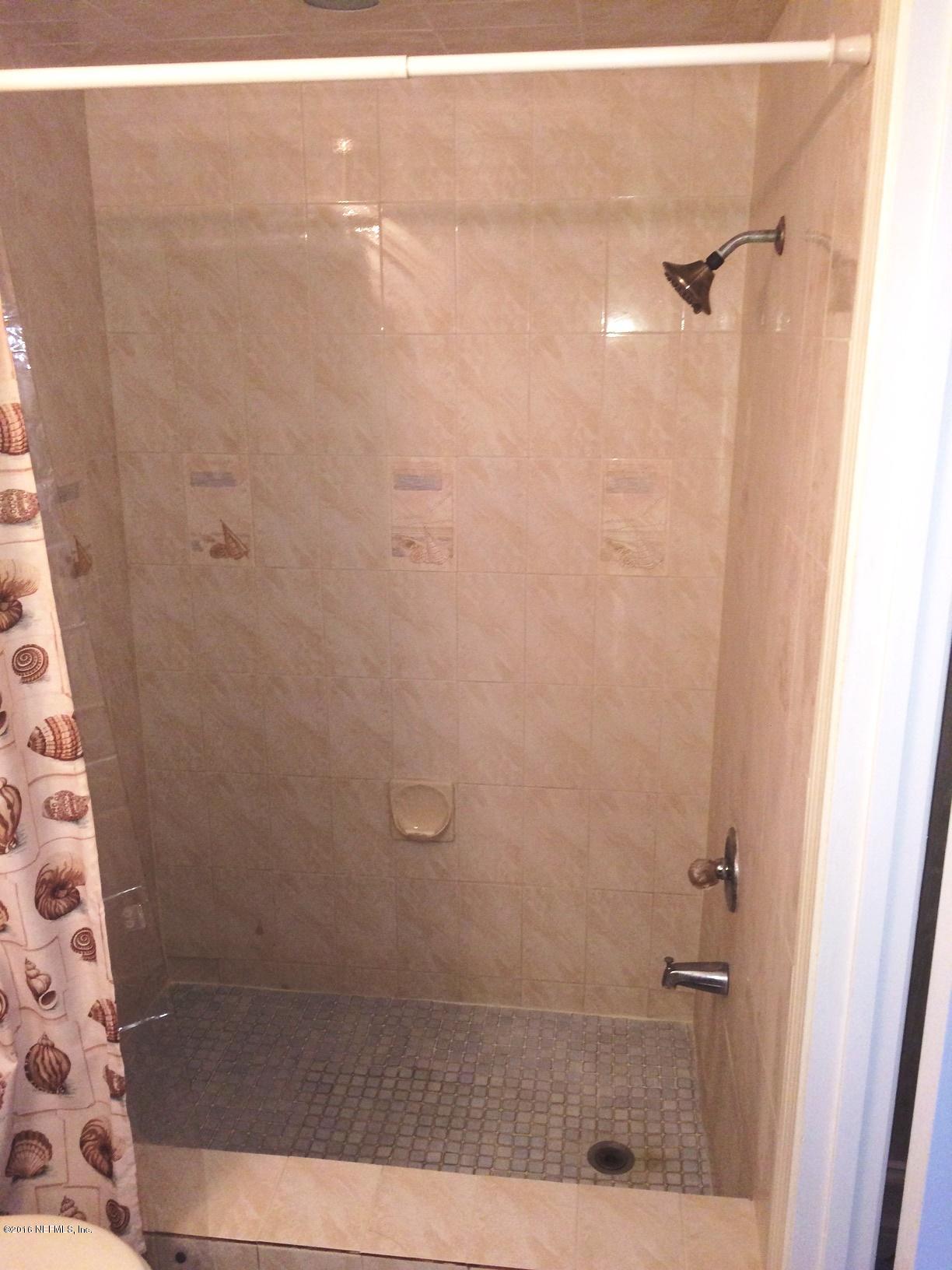 1112 Cactus Cut Road Middleburg, FL 32068 - Photo 19 of 48 a bathroom with a shower