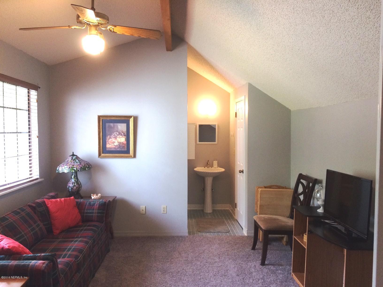 1112 Cactus Cut Road Middleburg, FL 32068 - Photo 22 of 48 a living room with furniture and a window