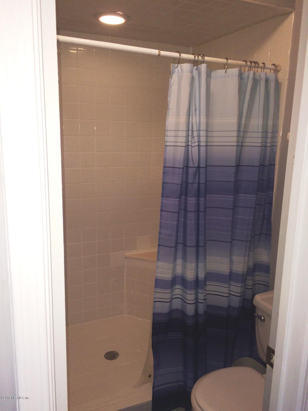 1112 Cactus Cut Road Middleburg, FL 32068 - Photo 24 of 48 a bathroom with a shower and a toilet