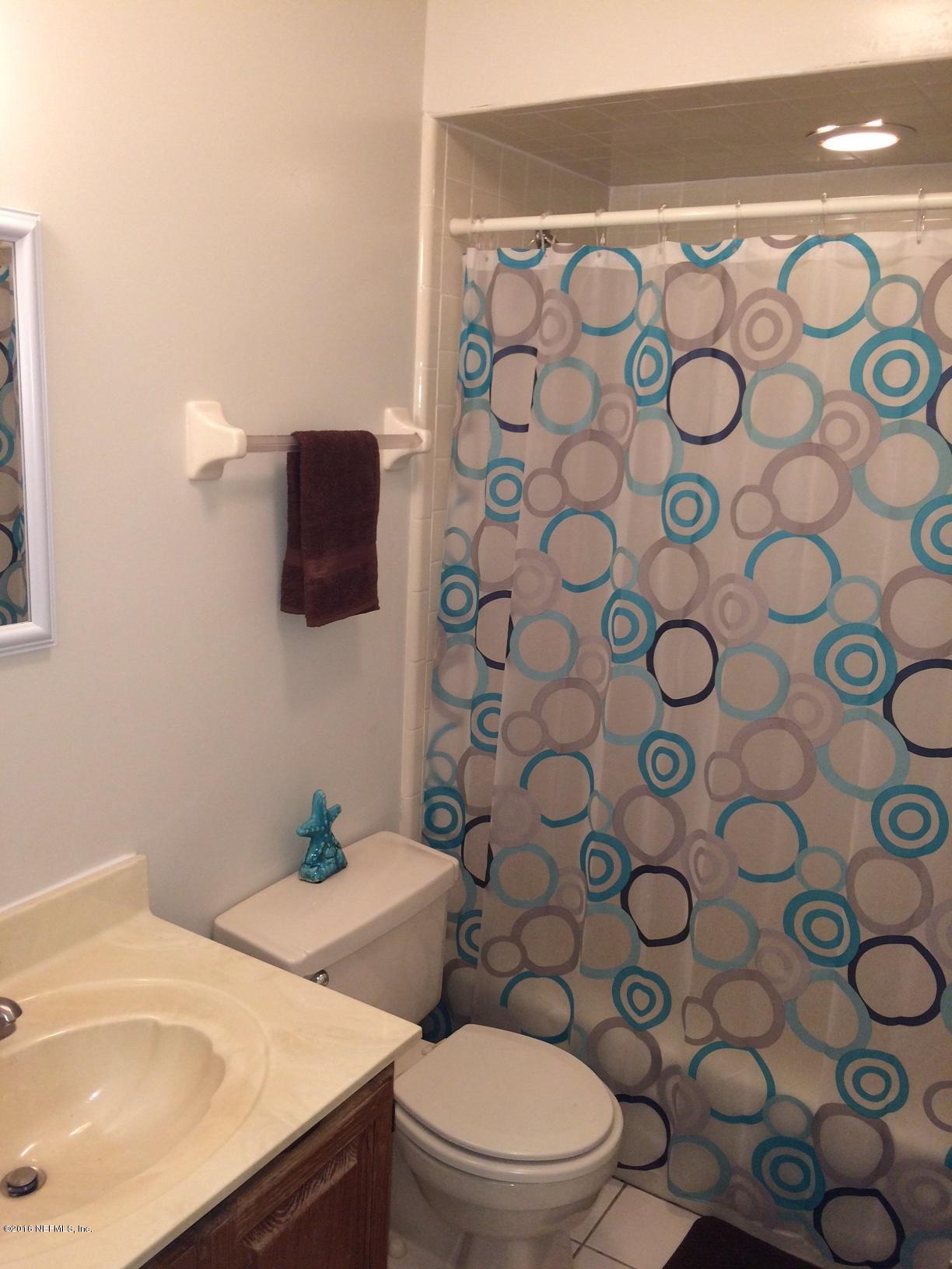 1112 Cactus Cut Road Middleburg, FL 32068 - Photo 30 of 48 a bathroom with a sink and a toilet