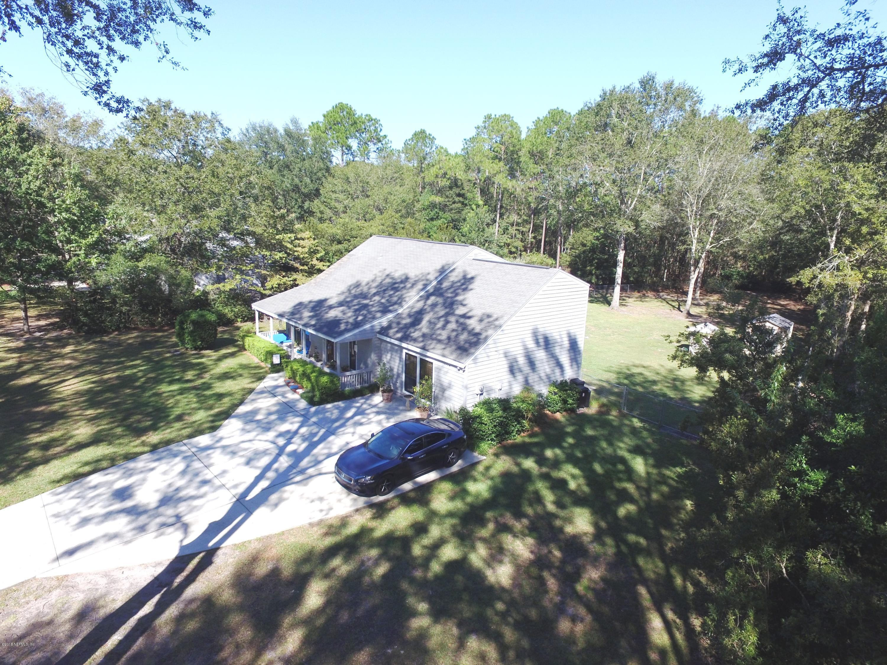1112 Cactus Cut Road Middleburg, FL 32068 - Photo 4 of 48 a view of a small house with a yard
