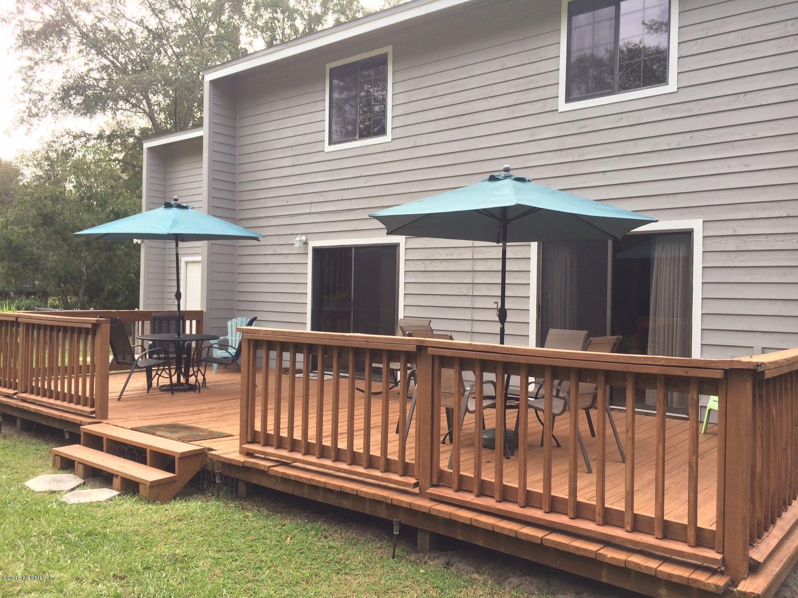 1112 Cactus Cut Road Middleburg, FL 32068 - Photo 6 of 48 a view of a chair and table in the patio