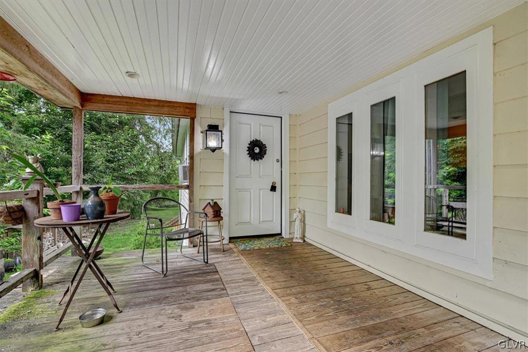 4825 River Road New Hope, PA 18938 - Photo 6 of 50 a view of a porch with furniture and a yard