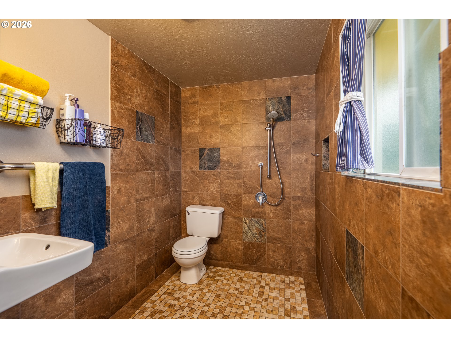 90 South 17th Street Cottage Grove, OR 97424 - Photo 10 of 23 a bathroom with a sink a toilet and shower