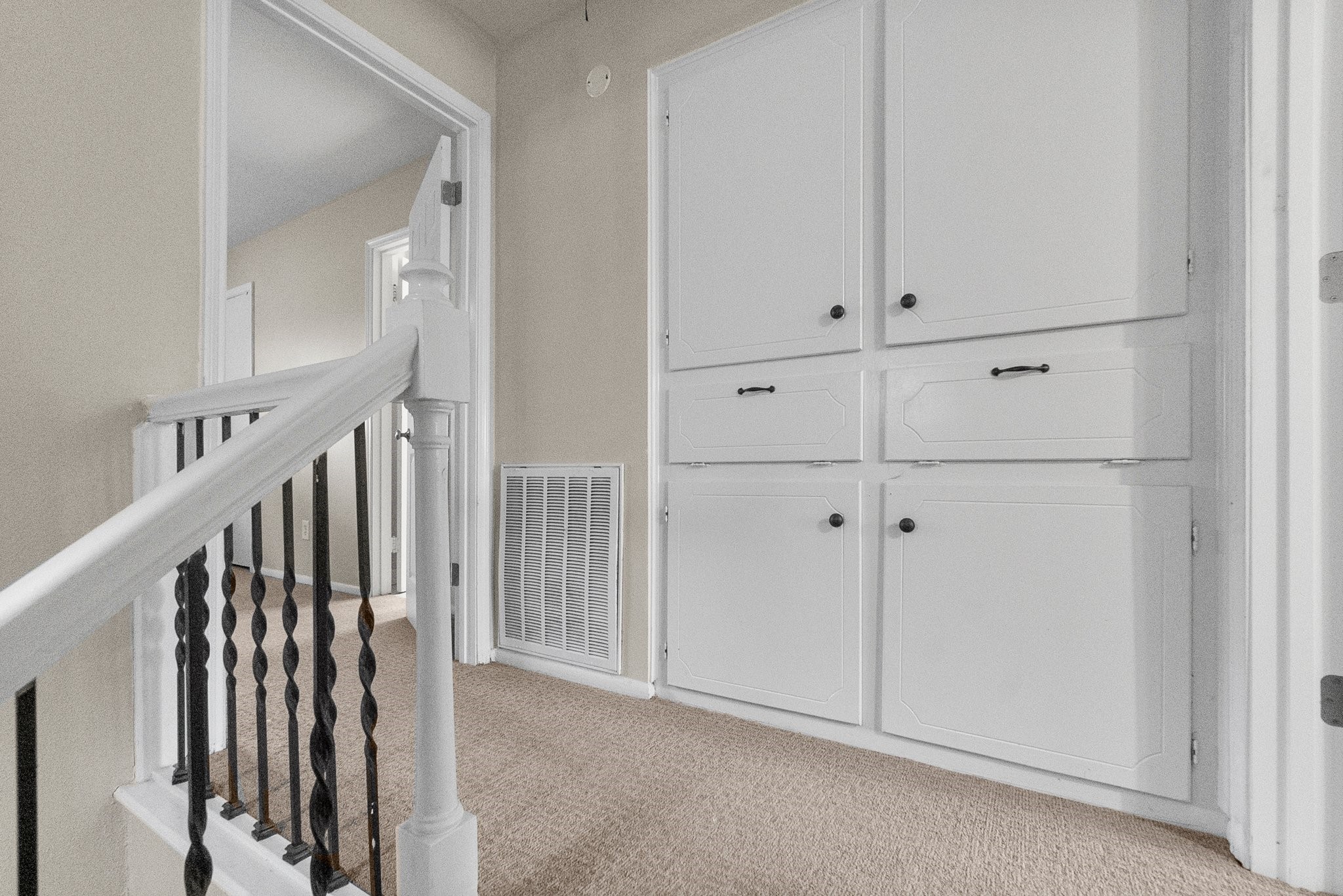 407 West Semands Street Conroe, TX 77301 - Photo 25 of 28 a view of a hallway with white cabinets