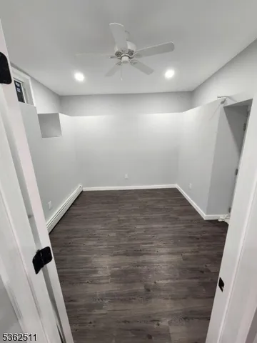 a kitchen with granite countertop a sink and cabinets