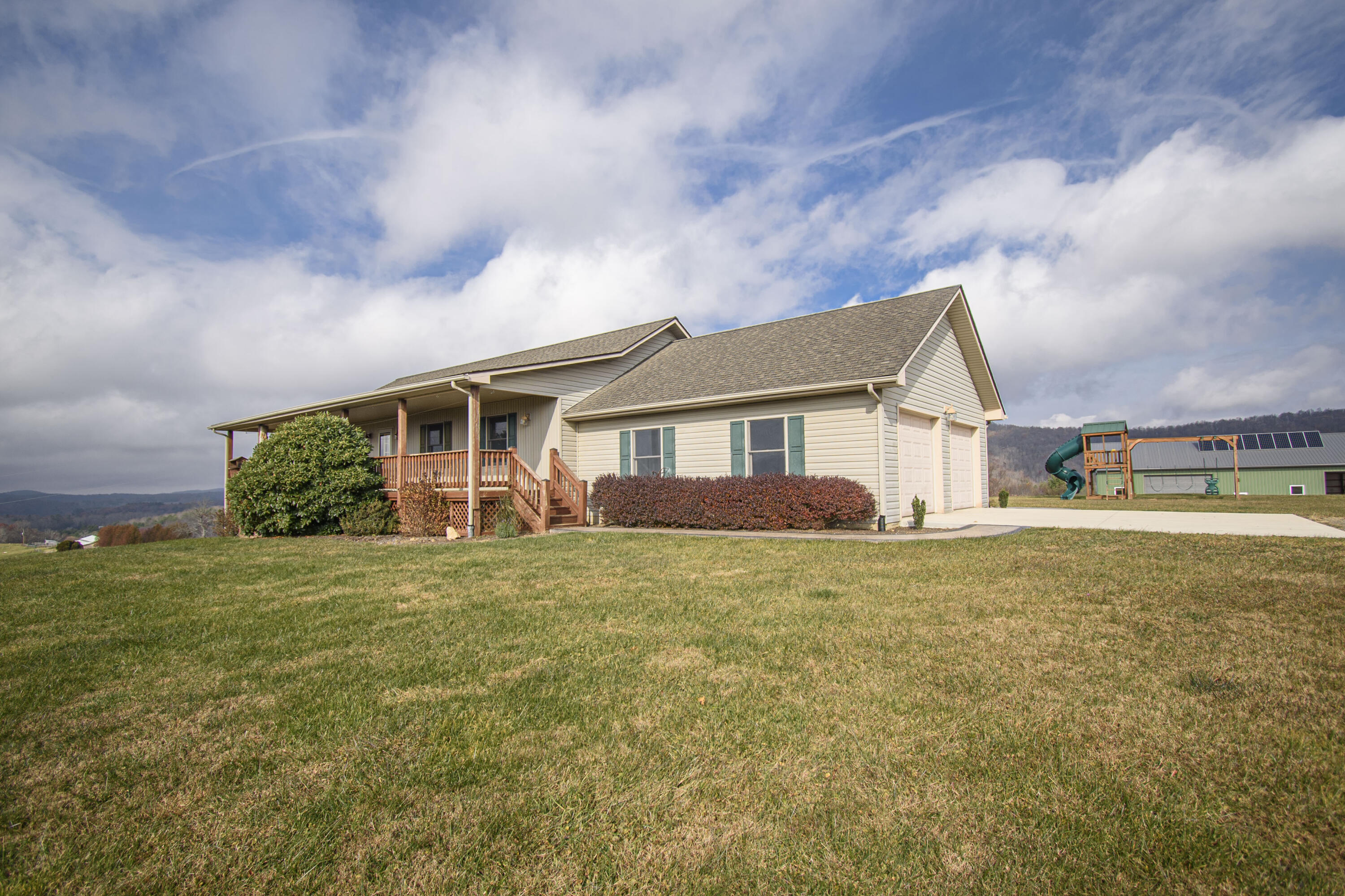 5485 Buffalo Mountain Road Southwest Willis, VA 24380 - Photo 13 of 77 a view of a yard in front of a house