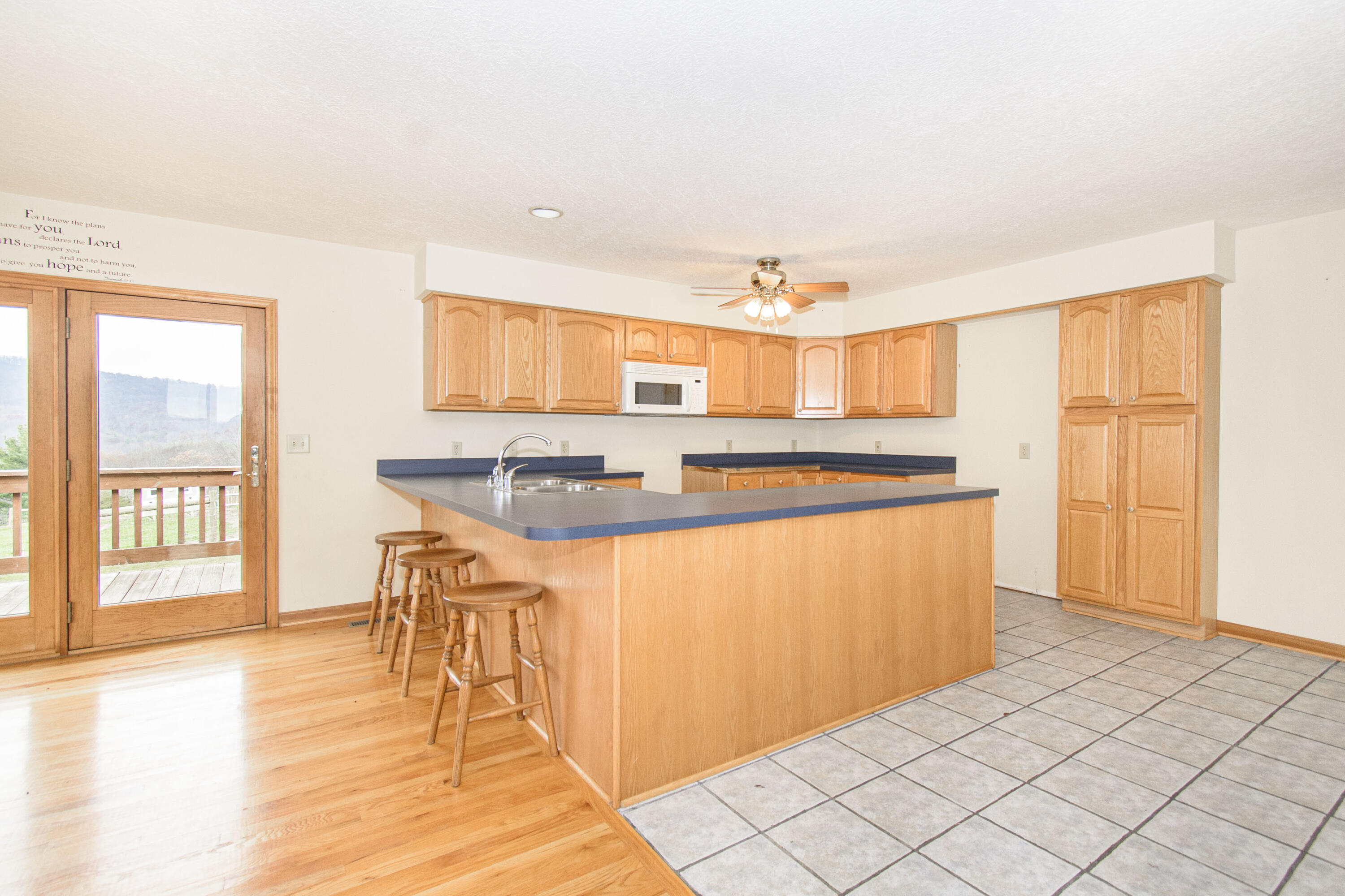 5485 Buffalo Mountain Road Southwest Willis, VA 24380 - Photo 22 of 77 a kitchen with stainless steel appliances granite countertop a stove a sink and a refrigerator