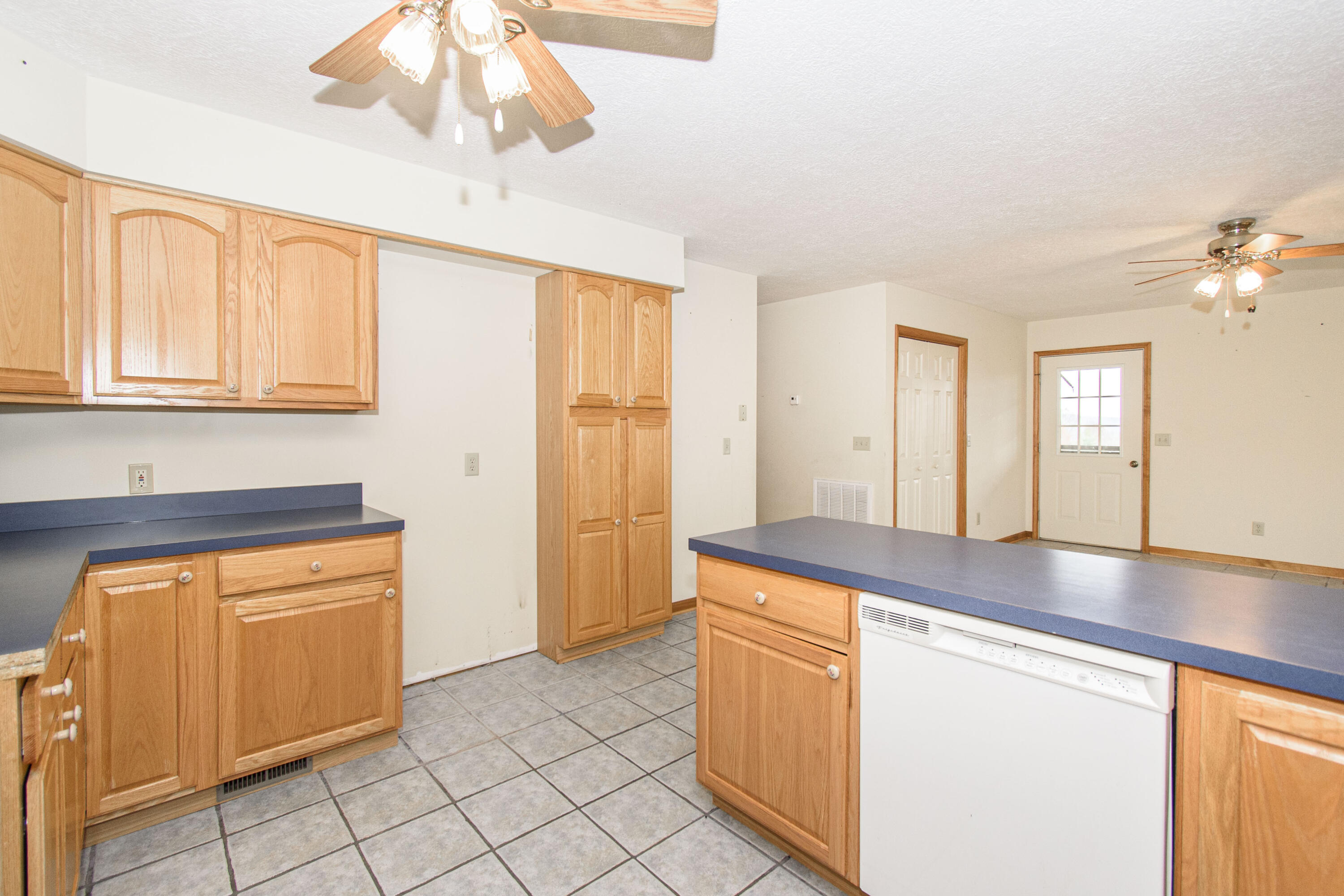 5485 Buffalo Mountain Road Southwest Willis, VA 24380 - Photo 26 of 77 a kitchen with stainless steel appliances granite countertop a sink and a white cabinets