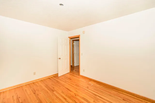 a view of a room with wooden walls