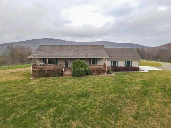 a big house with a big yard and more windows