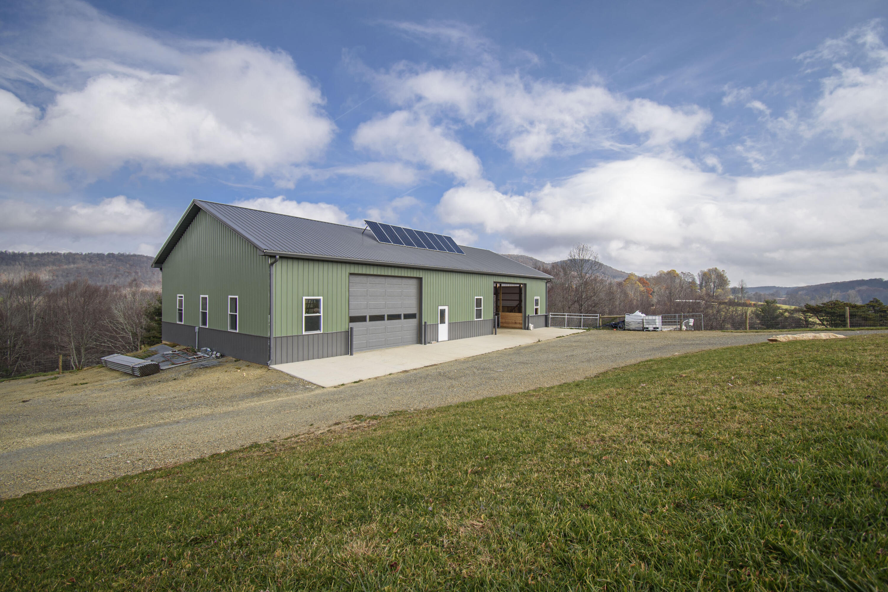 5485 Buffalo Mountain Road Southwest Willis, VA 24380 - Photo 47 of 77 a front view of a house with a yard and garage